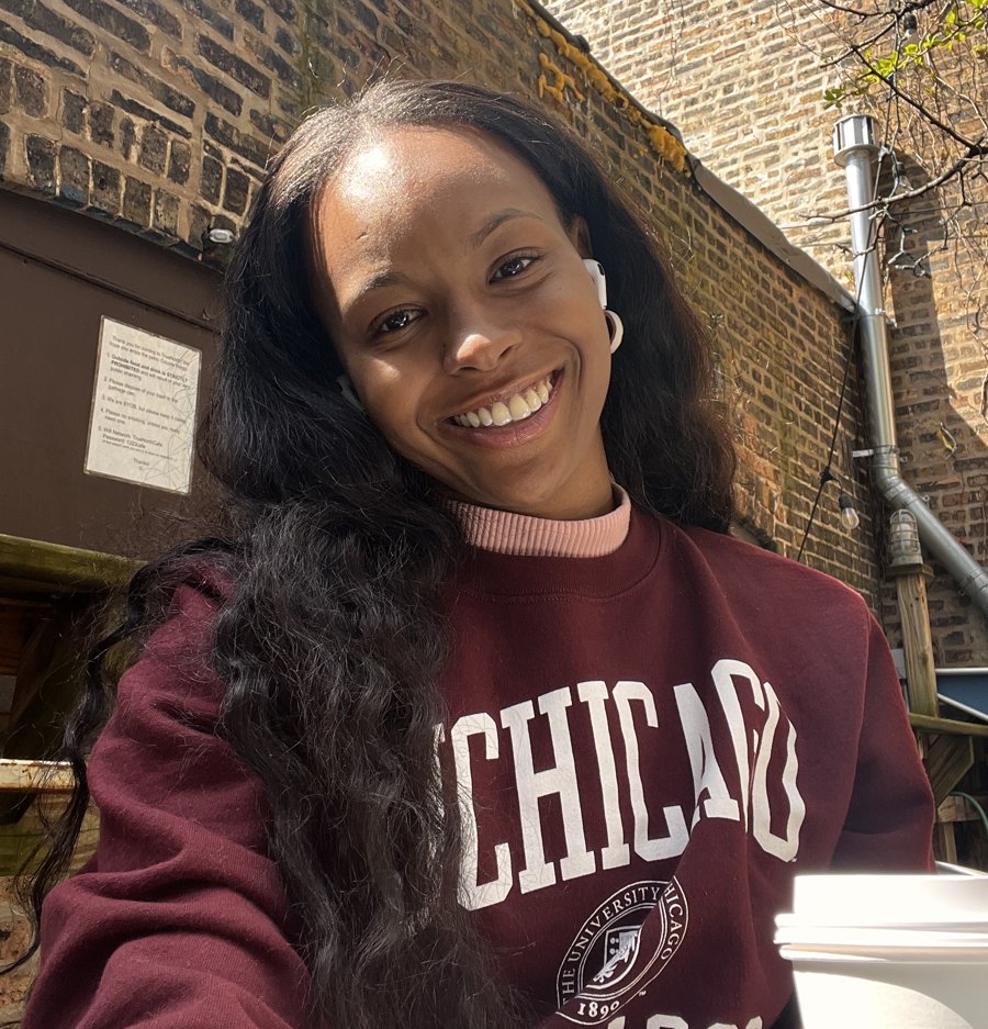 Jovanay Carter smiling in a maroon University of Chicago sweatshirt